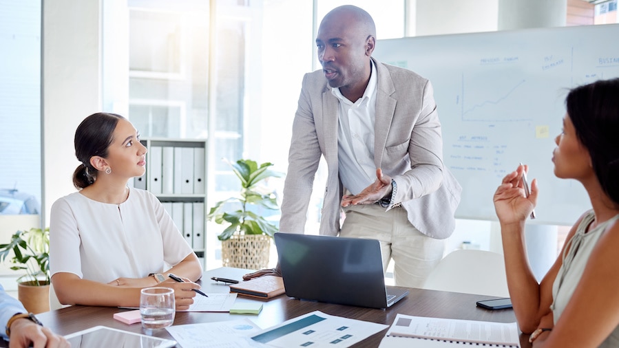Businessman speaks in a group meeting