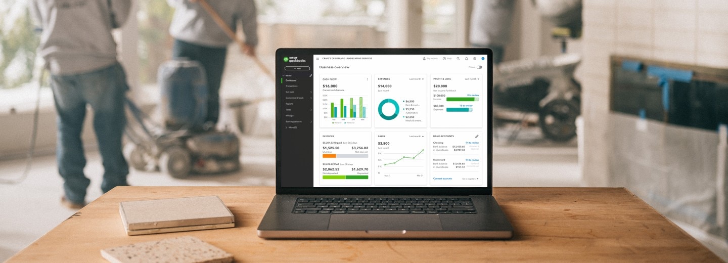 A laptop computer in a small business environment displaying a QuickBooks dashboard
