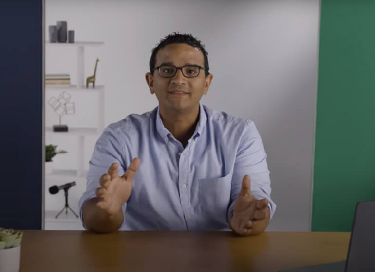 Accountant at a desk giving guidance.