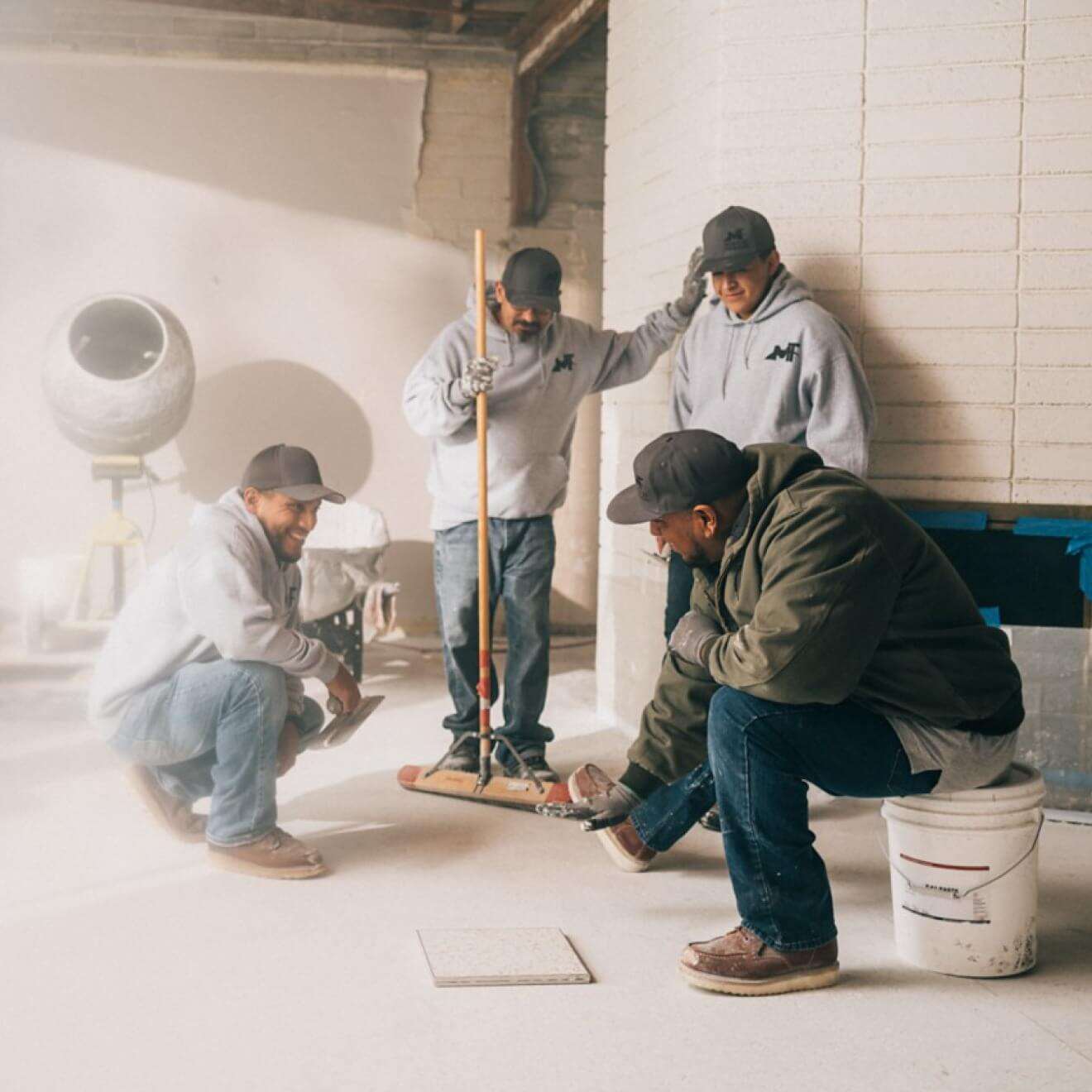 Photo of a small business owner talking with his team.