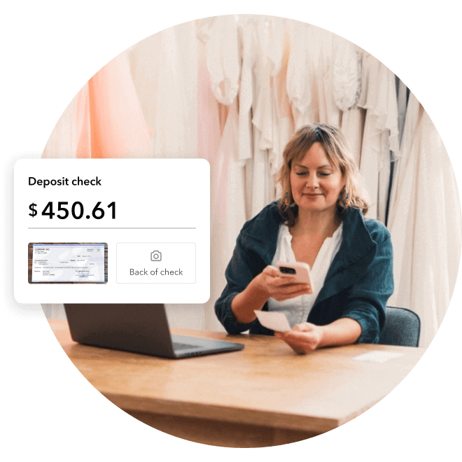 Bridal designer depositing a check with their phone, deposit screen shows image of the check.
